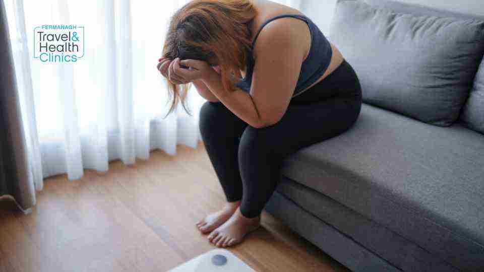 Woman struggling with a weight loss plateau